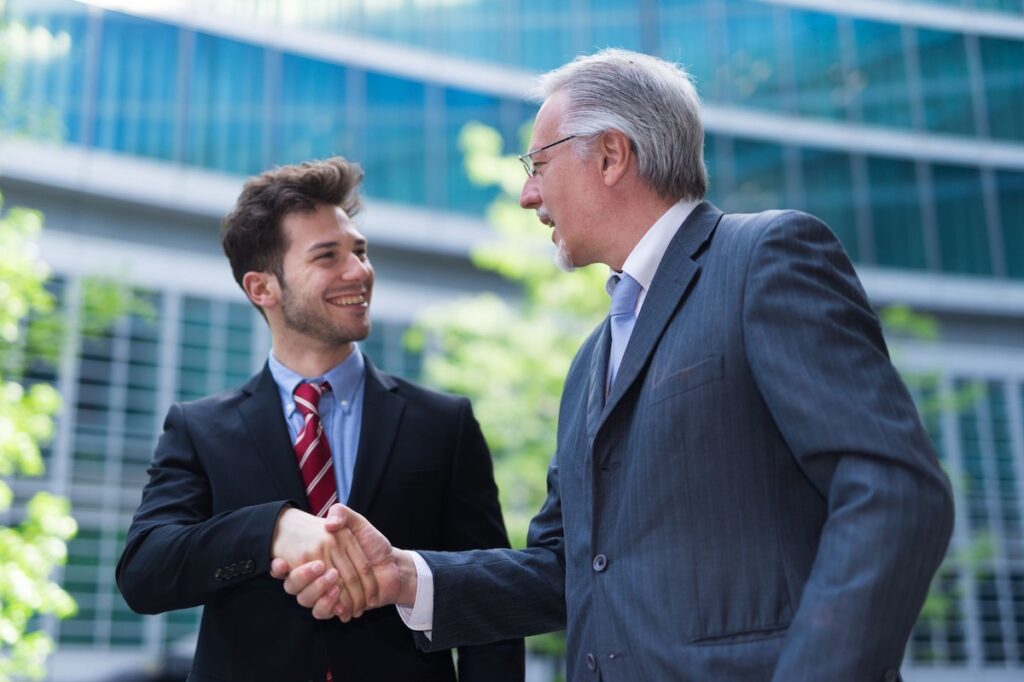 Two business men shaking hands