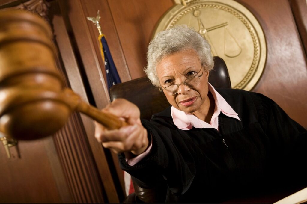 Judge angrily pointing gavel
