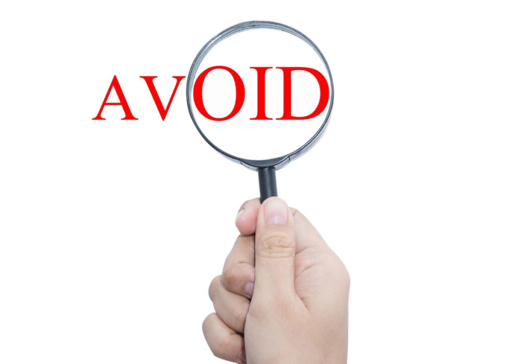 The word Avoid with a magnifying glass