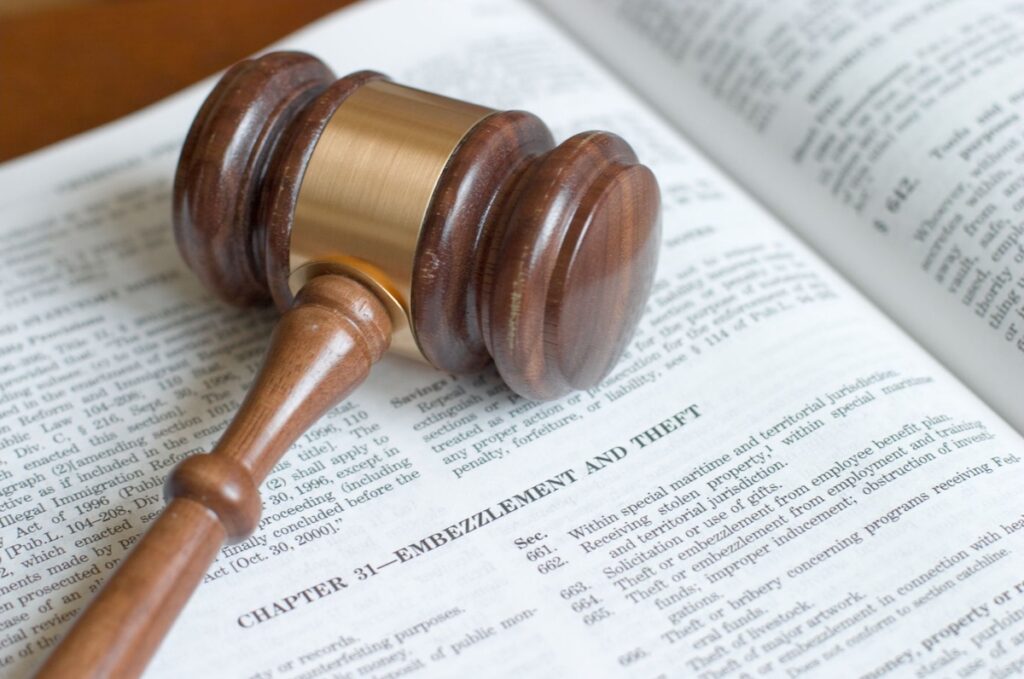 Law book with theft and embezzlement chapter