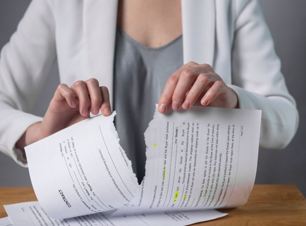 Woman tearing up a contract