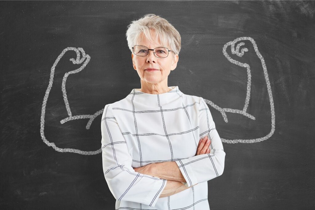 Business woman with muscular arms behind her