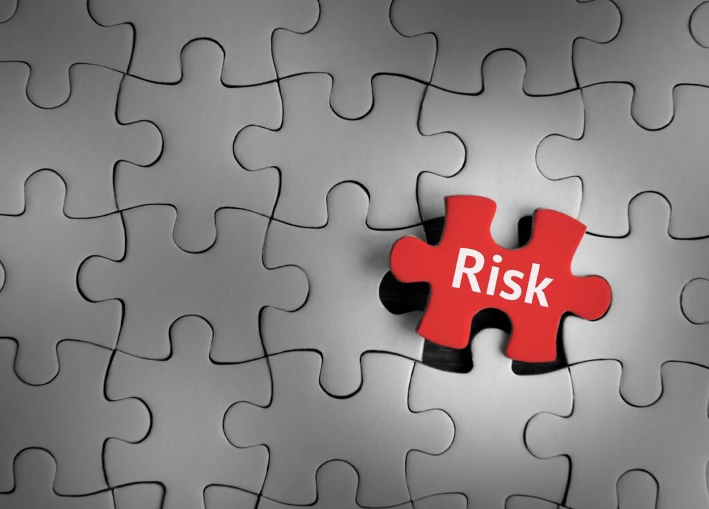 Jigsaw with risk piece