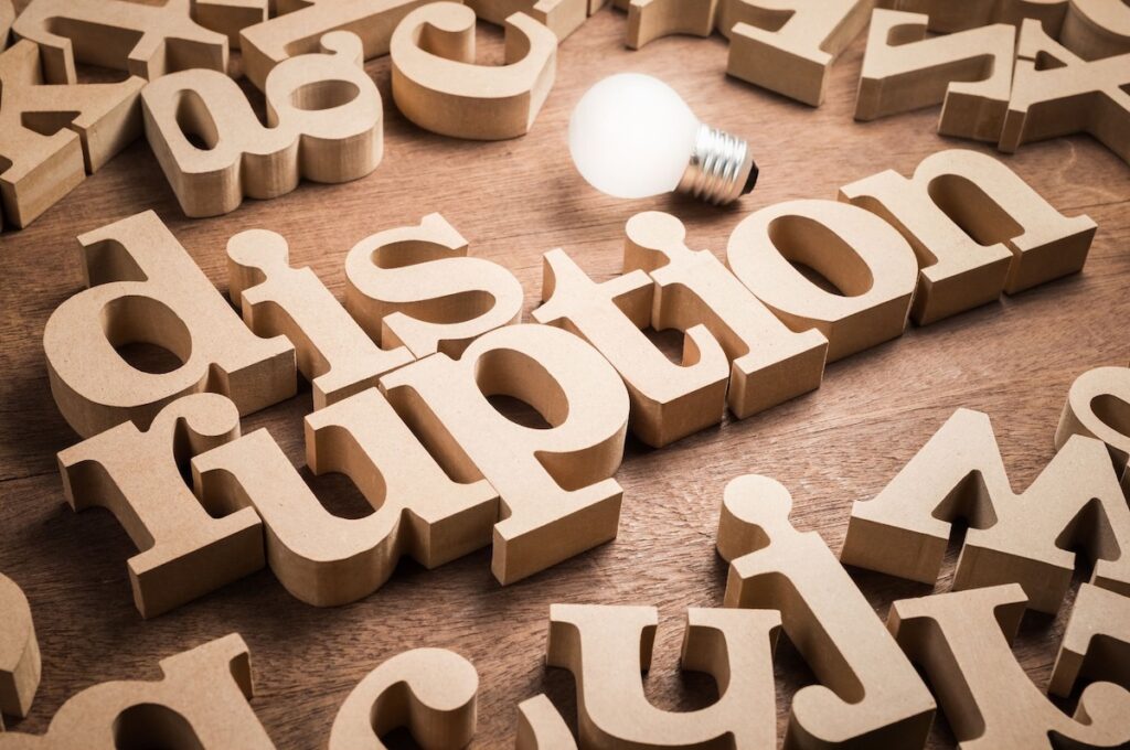 Disruption spelled out in wooden letters