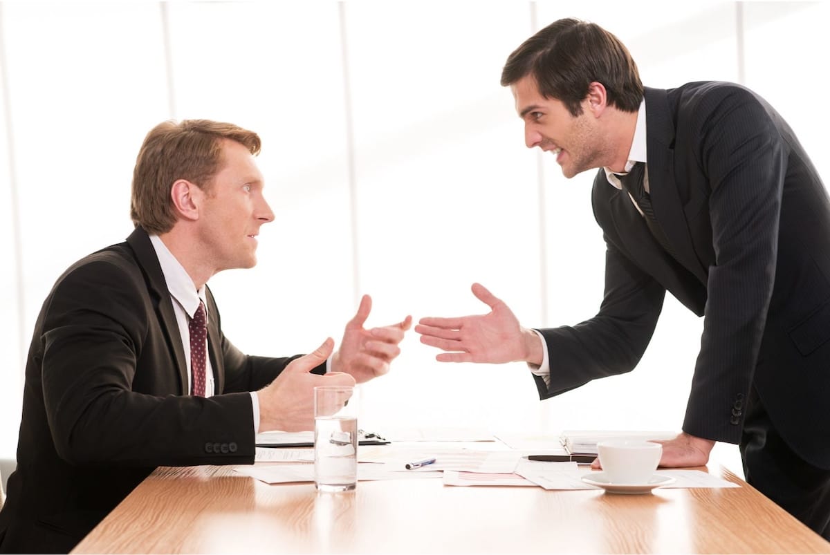Businessmen disagreeing