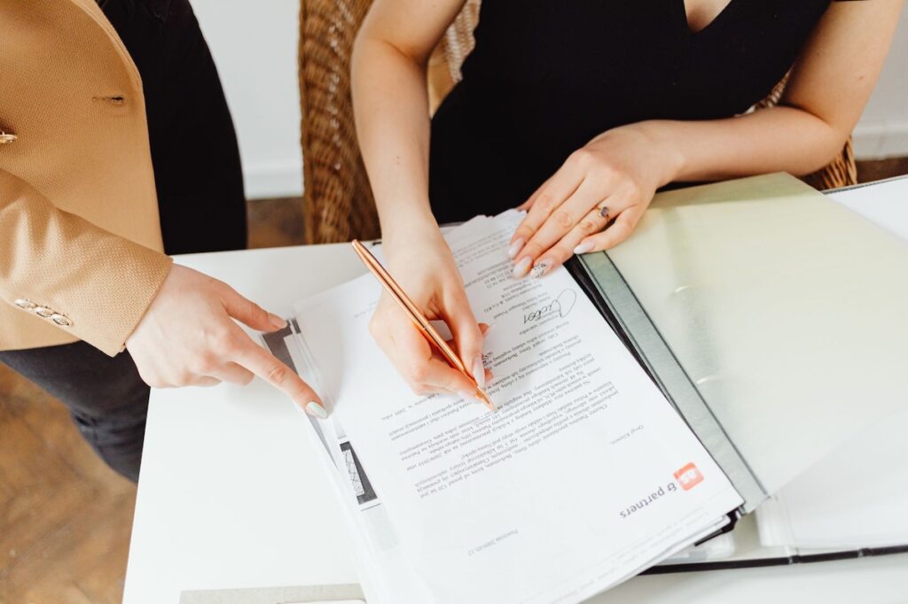 Business women signing an agreement