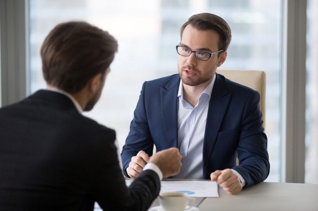 Two businessmen meeting with each other.