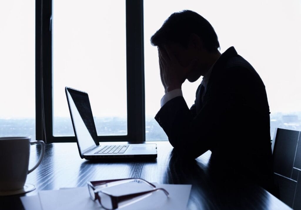 Business Man Grieving